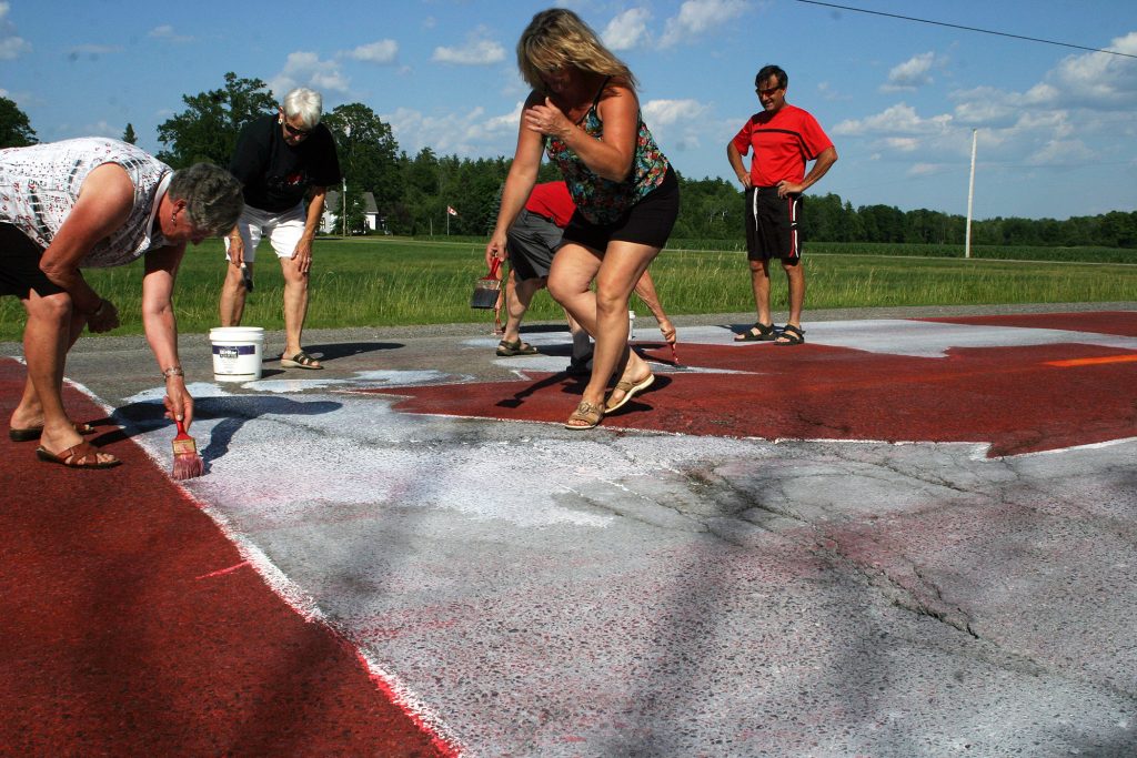 The final shift of the day was a family affair for the annual Canada Day flag painting. Photo by Jake Davies