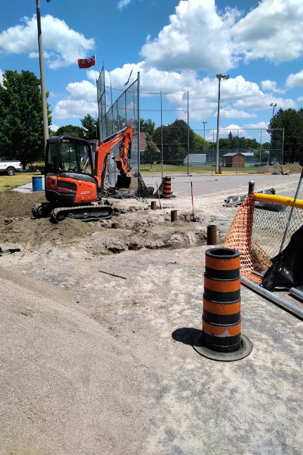 Volunteers work on installing a new fence around the diamond. Courtesy the U23 Canadian Fast Pitch Championship organizing committee