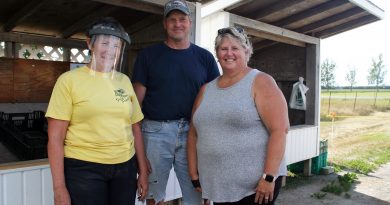 From left, Liz, Brian and Lynn Hudson were kept hopping at the opening day of Hudson's Farm Fresh Produce stand beside the farm on Panmure Road. Photo by Jake Davies