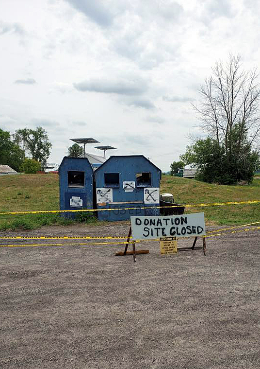 This large sign was not enough to deter people from piling up a huge amount of garbage in front of an untended donation bin. Courtesy Lisa Rath