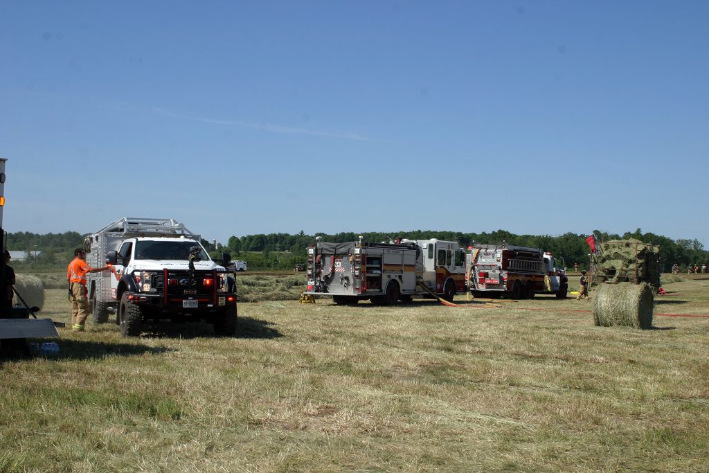 Ottawa firefighters brought out an array of equipment to battle the blaze and make sure the hay fire didn't spread to nearby homes. Photo by Jake Davies