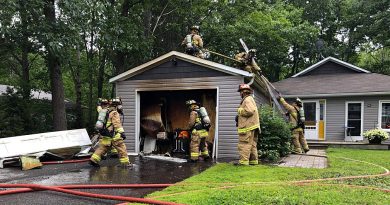 Volunteer firefighters tackle a garage fire this afternoon on Bayview Drive. Courtesy District 6 Chief Bill Bell
