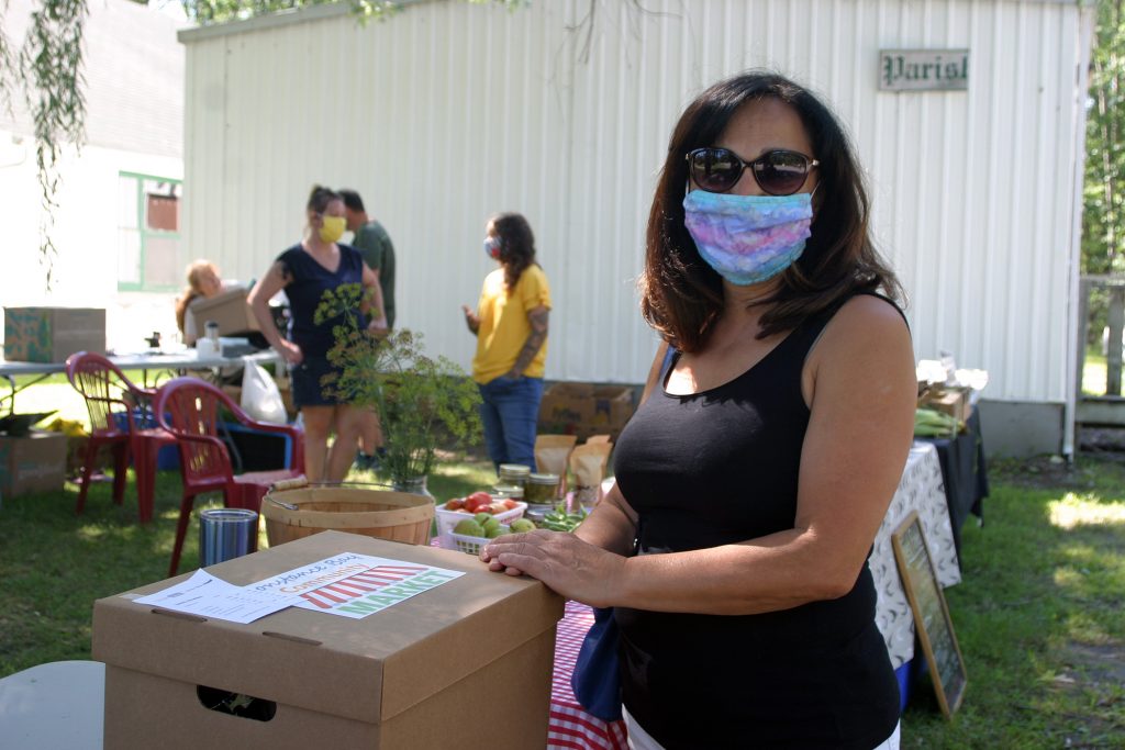 Linda Hawkins picks up her CBCM Cheer Box last Saturday. Photo by Jake Davies