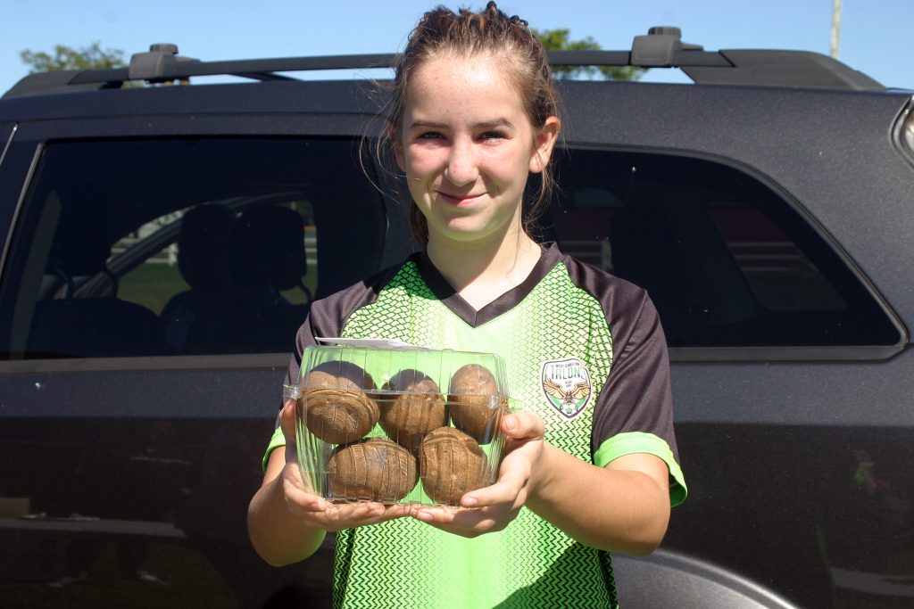 Ashley Keefer, 13, shows off her potato submisson.