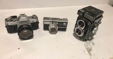 A photo of three different cameras.