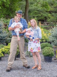 owners Jonathan Merchand & Tori Renaud with their daughters.