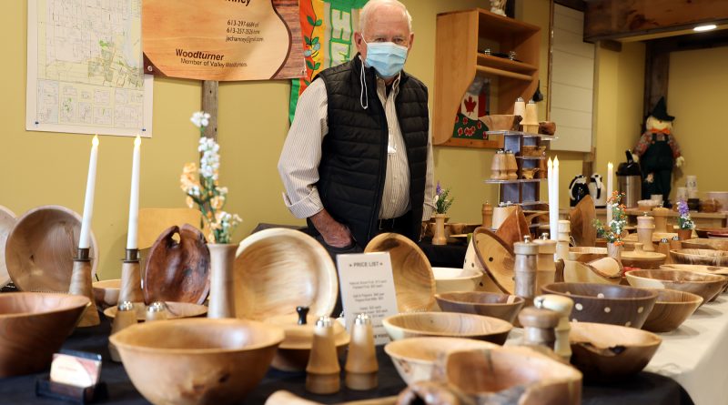 Woodturner John Chamney poses with his work during the Red Trillium Studio Tour.