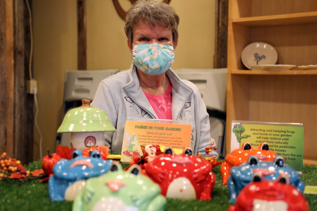 Potter Carol Holmes-Kerr and some of her whimsical creations. Photo by Jake Davies