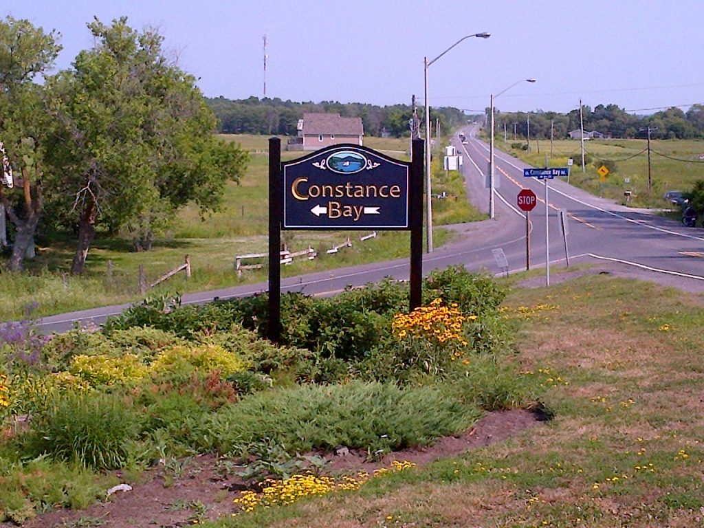 A photo of the entrance sign as it looked before its destruction.