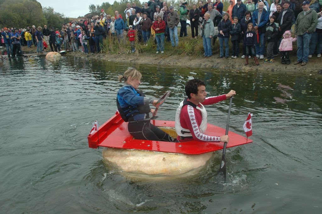 Rick Mercer paddles a pumpkin.