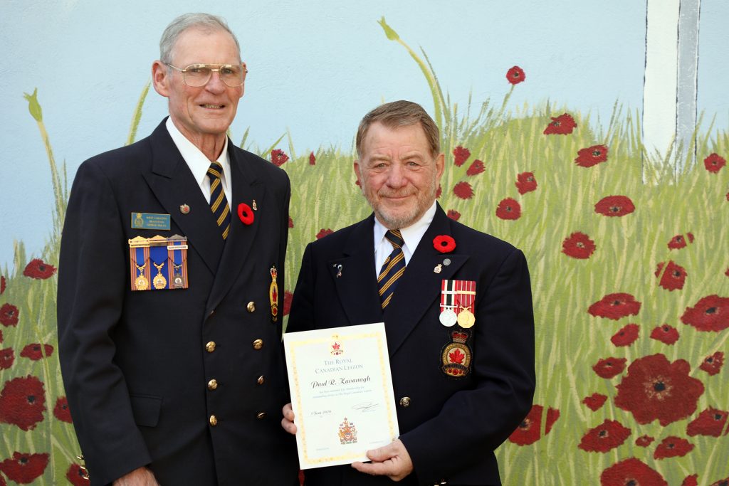 Branch 616 President George Dolan (left) presents Paul Kavanagh with his lifetime membership.