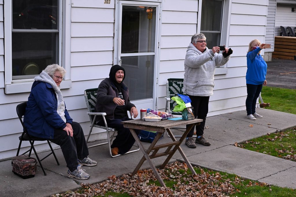 Dave Creighton and friends watch a birthday parade in his honour.