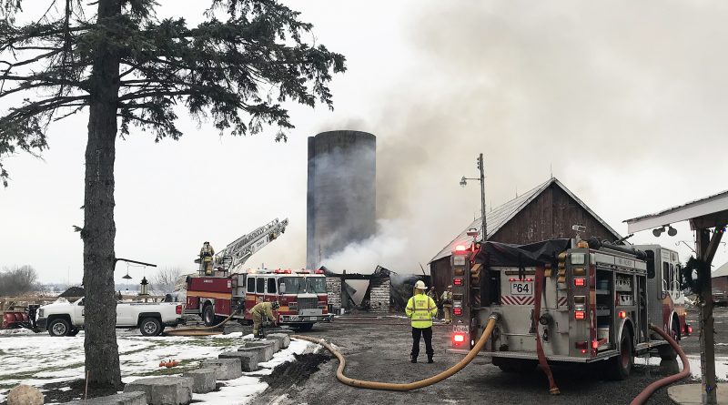 Firefighters attack a Monday morning farm fire on Diamondview Road.