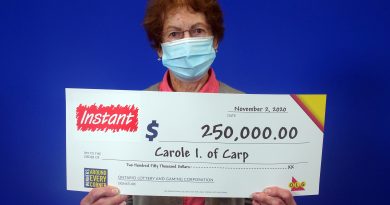 Carp's Carole Ittermann poses with her big cheque.