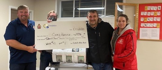 Royal Canadian Legion Branch 192 president Peter Schaffer and Carleton Place & District Memorial Hospital Foundation chair Ian Grant present the cheque for $24,996 to winners Chad Hastie and Leanne Hall.