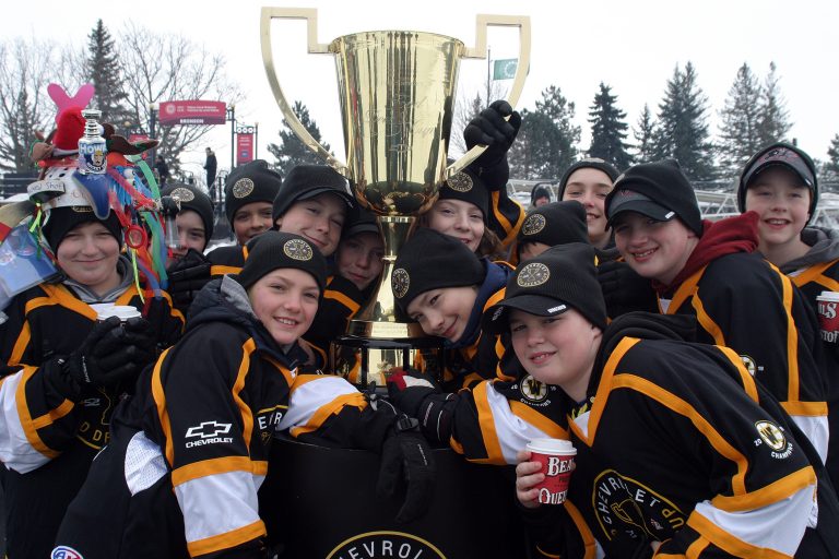 Warriors pose with the Good Deeds Cup.