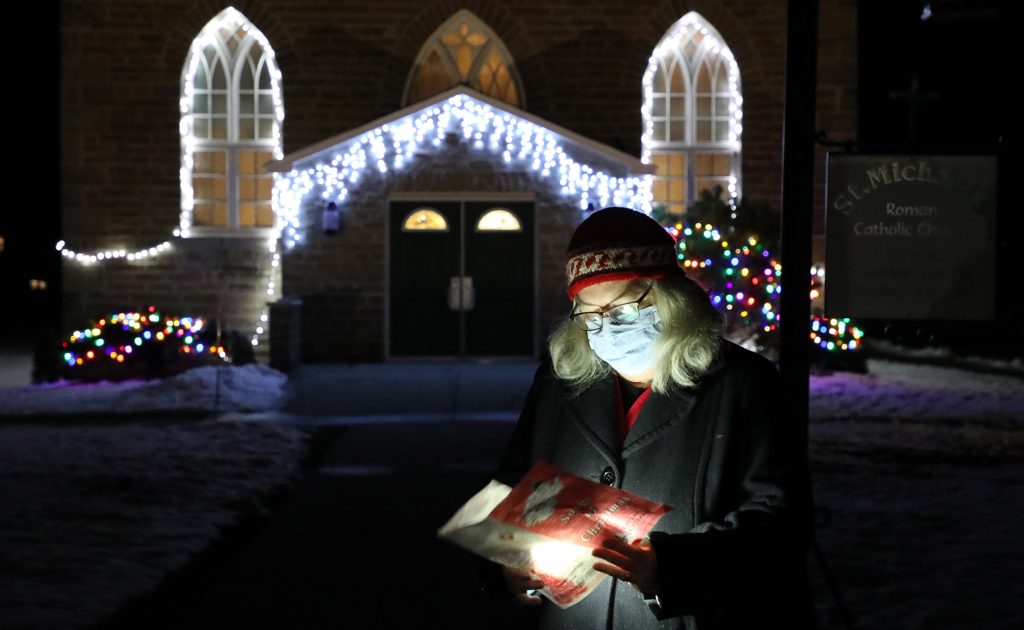 Rev. Dr. Christine Johnson recites a prayer in front of Bethel-St. Andrew's church.