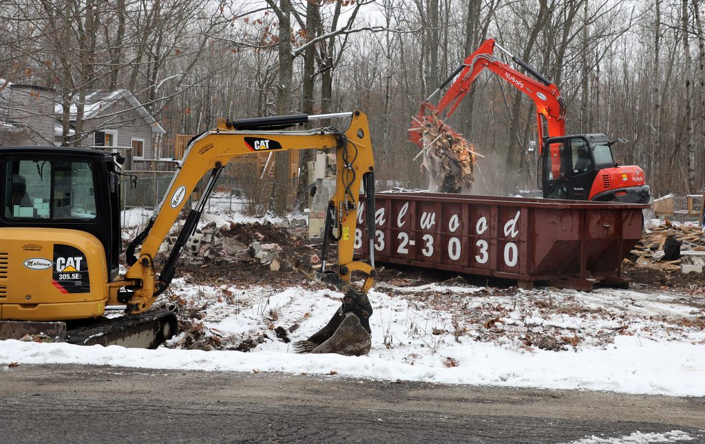 Malwood Aggregates clean up the rubble of the Lepage's demolished family home.