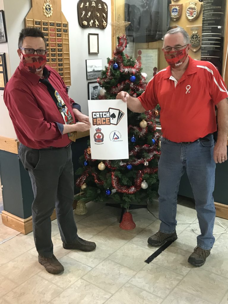 Al Roberts from the AGH FVM Foundation and Dave Cormier from the Almonte Legion unveil the logo.