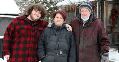 A photo of Joshua Tuepah, Brenda Coulter and Larry Coulter.