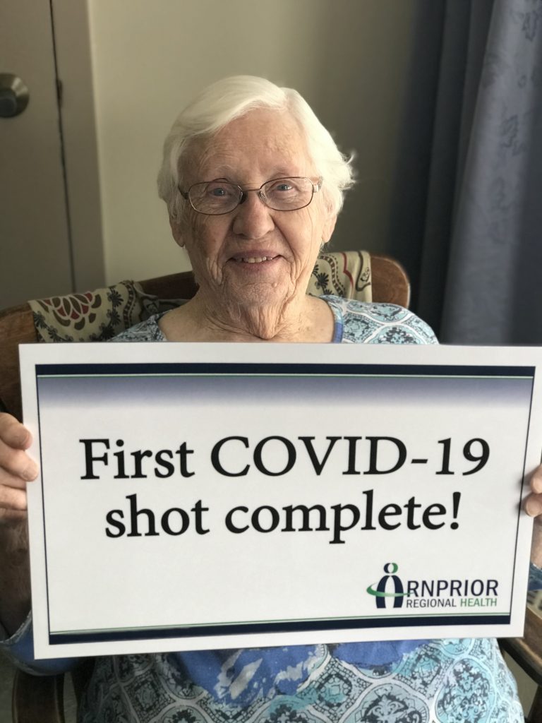 Grove resident Rita Colterman celebrates receiving her first inoculation of the COVID-19 vaccine.