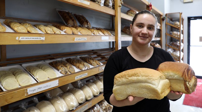 Valdete Nuhijaj shows off some of the Carp Bakery's bread.