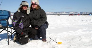 Fitzroy Harbour’s Jody Brenton and Arnprior’s Catherine Buffam-Jensen pose by their fishing holes during last year’s fishing derby. Photo by Jake Davies