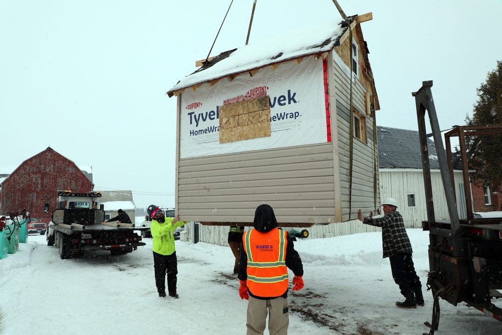 The bunkie is placed on a flatbed.