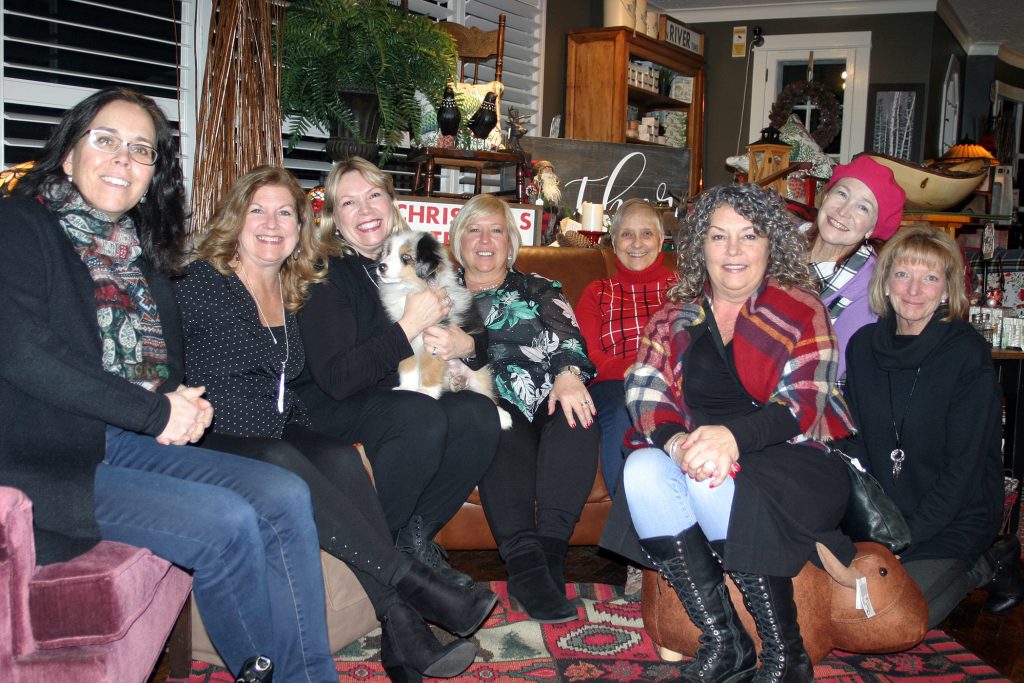 The staff of the Carp Cabin pose for a photo.