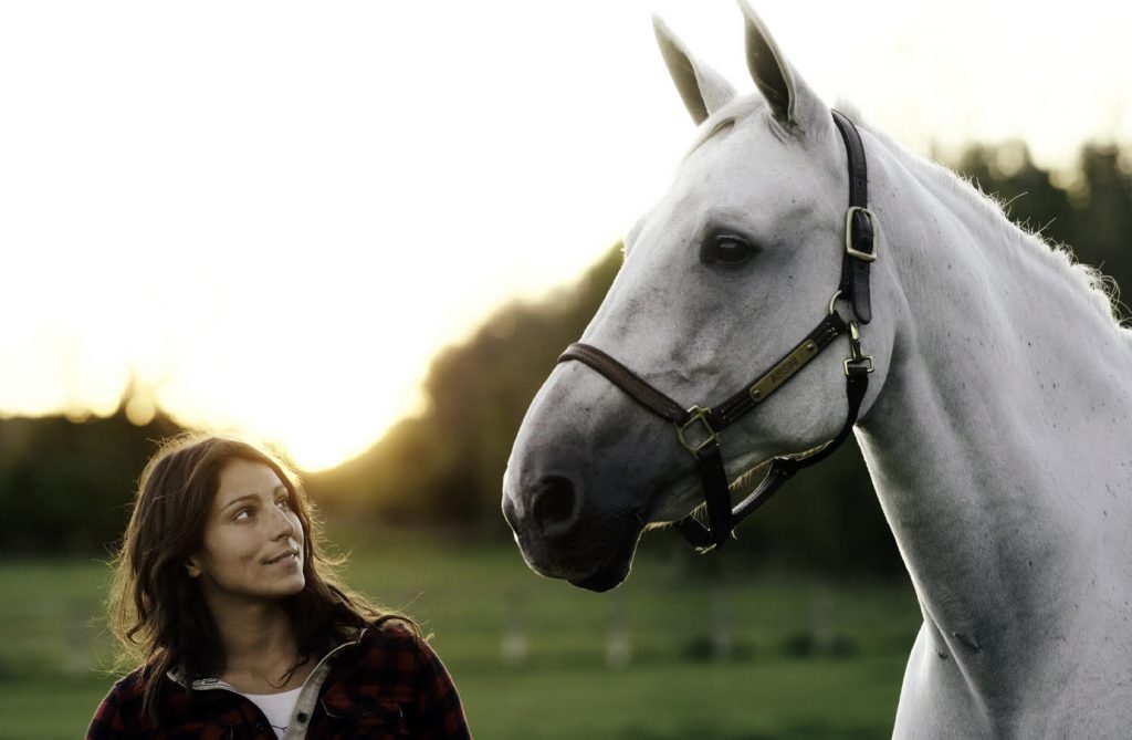 Charlotte Smith and a white horse.