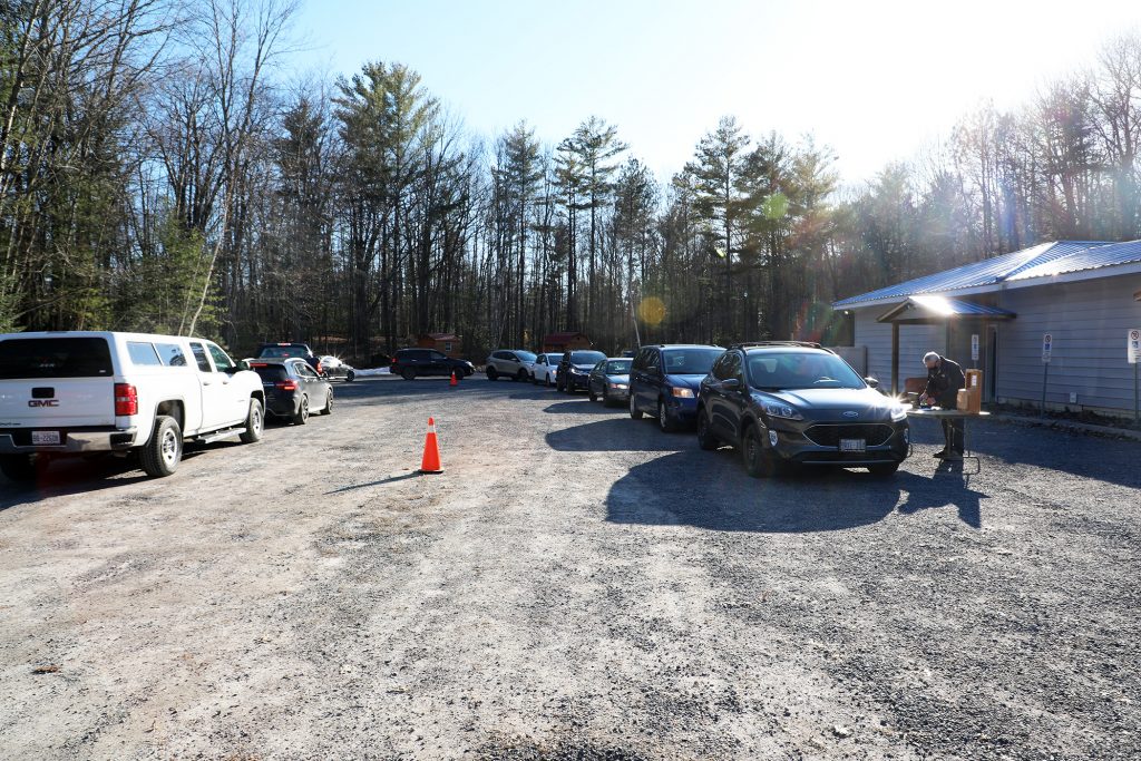 A line-up of cars waiting for the Wheels to Meals dinner.