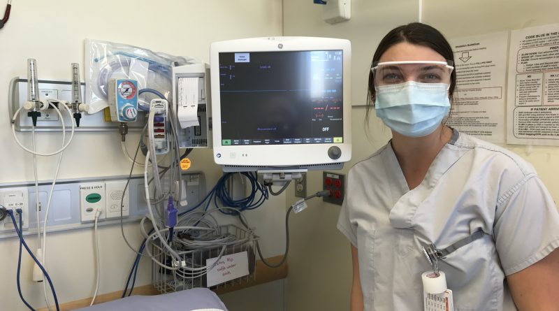 Emergency Department Registered Nurse Taylor Crites with the new cardiac monitor.