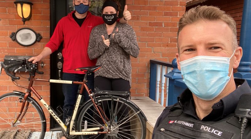 Const. Ryan Cuthbert returns a bike to its happy owners.