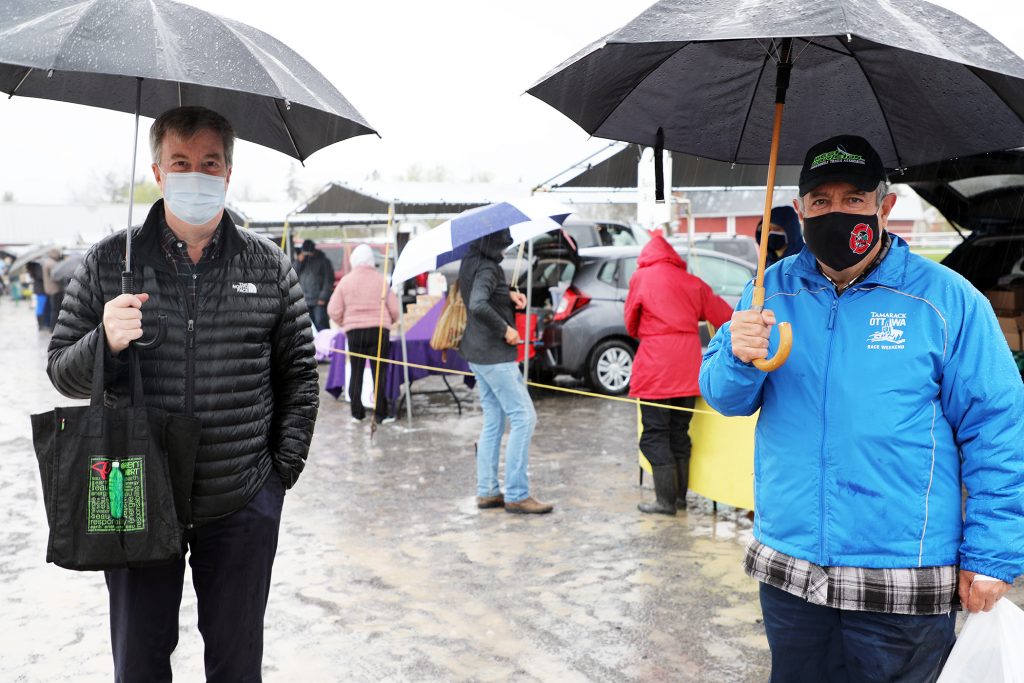 A photo of Mayor Jim Watson and Coun. Eli El-Chantiry at the market.