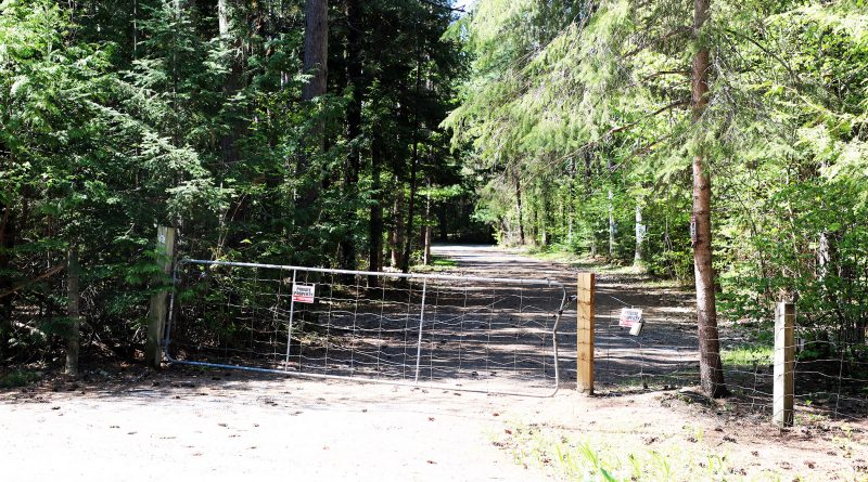 A photo of the Camp Woolsey gates.