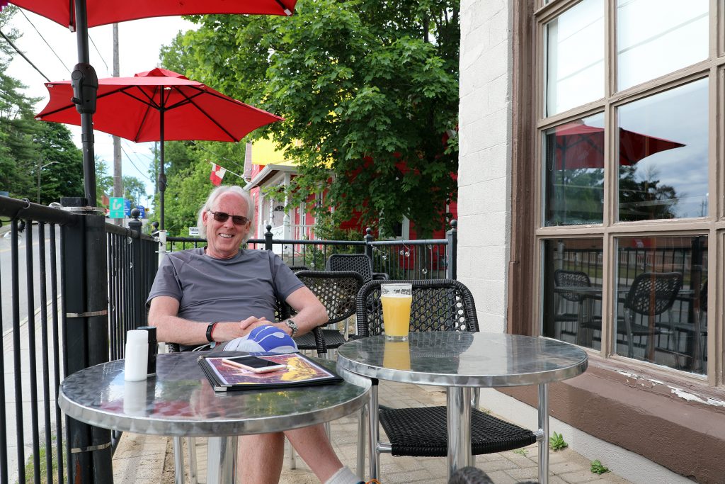 Doug Tansley sits on the Juke Joint patio.