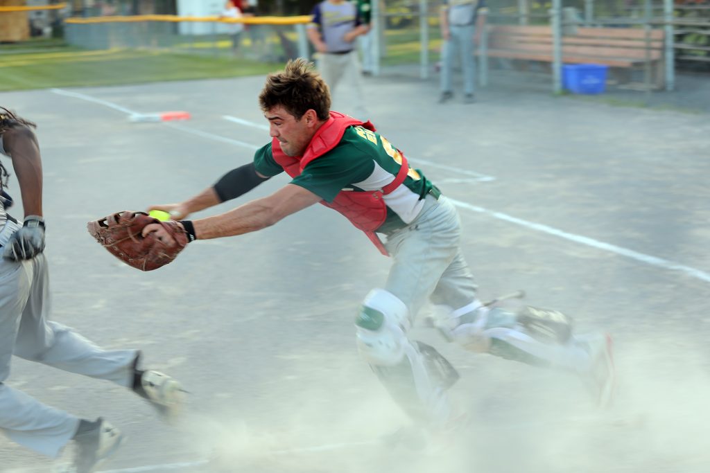 A’s catcher Jackson Vance comes up just short trying to tag ‘Tric Alex Boucaud who made it safely back to third in a wild first-inning play. Photo by Jake Davies