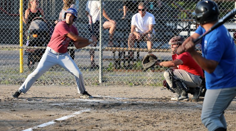 Harbour Ball player Ben Wilson takes a swing.