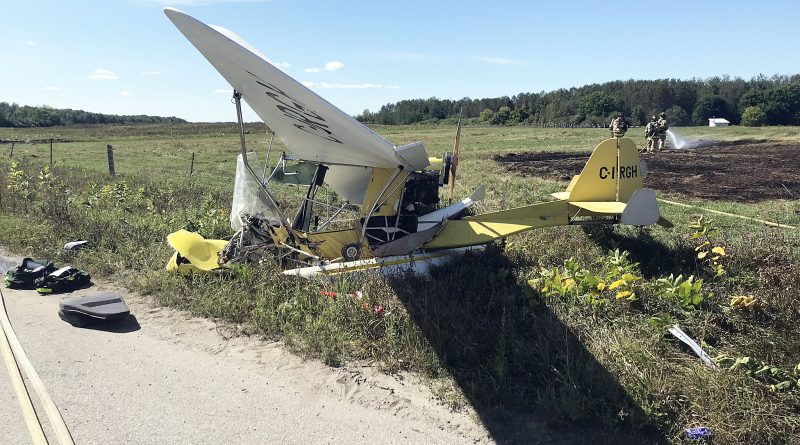 A photo of the two-seater, crashed airplane.