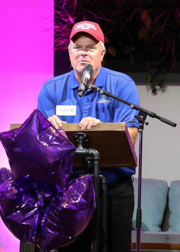 Aquatopia owner Nicholas Bott speaks to the crowd.