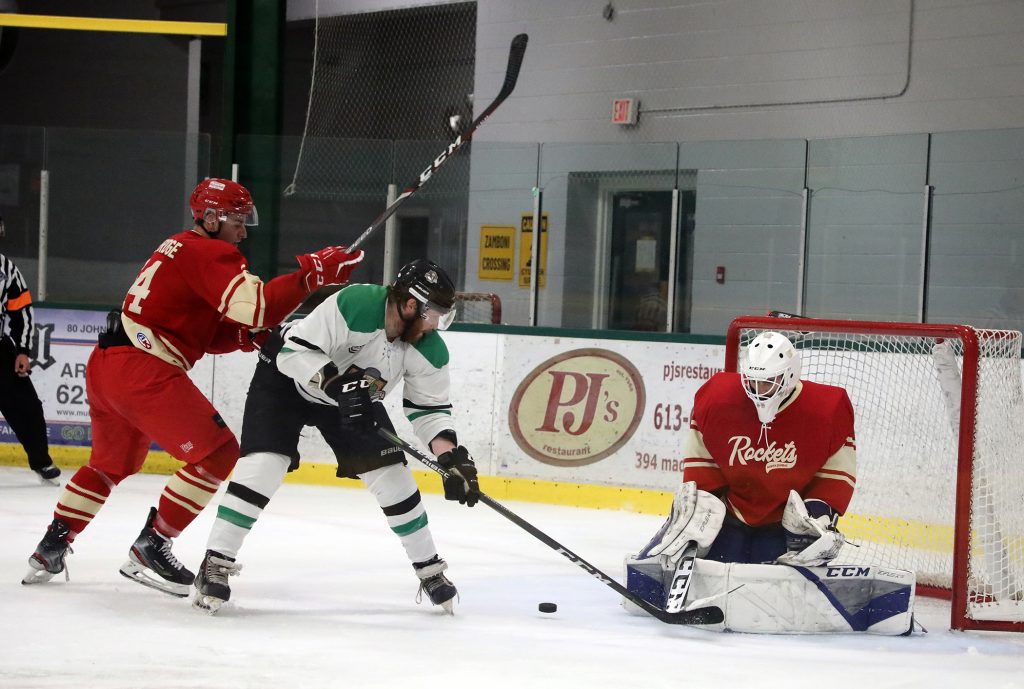 A player deflects the puck on net.