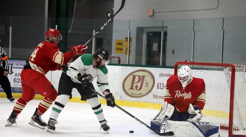 A player deflects the puck on net.