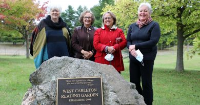 A photo of four members of the garden glub in the reading garden.