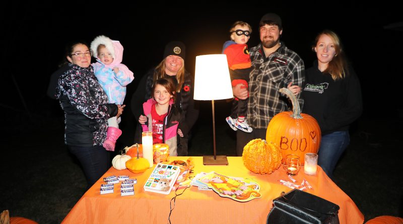 A group photo of trick-or-treaters.