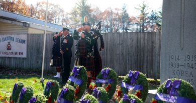 Servicemen salute as Taps is played during Constance Bay's Remembrance Day service.