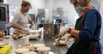 A photo of volunteers making pies.