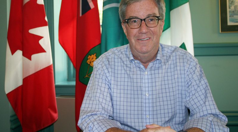 A photo of Mayor Jim Watson in his office.