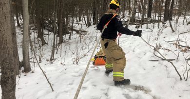 An Ottawa firefighter pulls a sled.