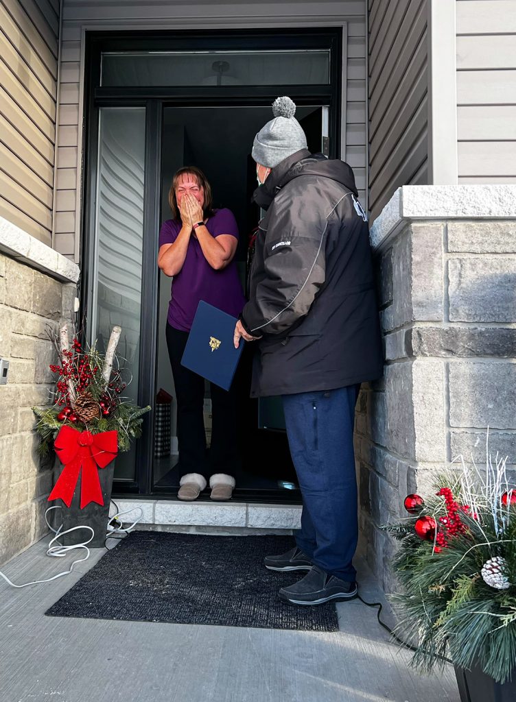 A photo of Barbara answering the door.