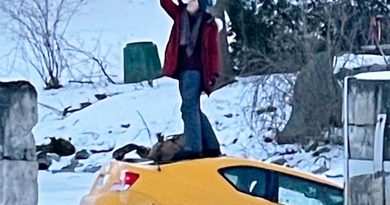 A woman takes a selfie after breaking through the Rideau River in her car.